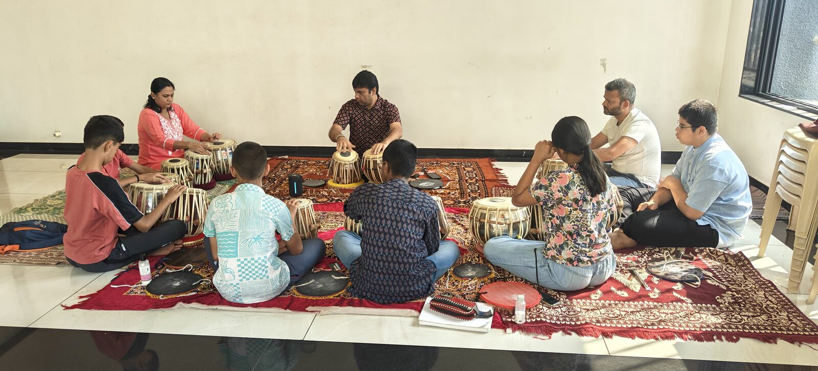 Students of all ages learning the tabla